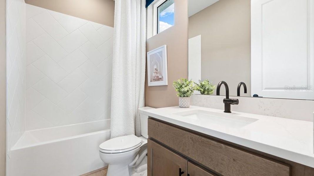 Furnished interior view inside a new home in Esplanade at Starling, Punta Gorda (Image 4).