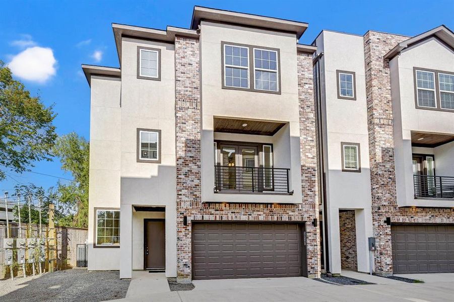 Beautiful Front Elevation with brick and stucco.