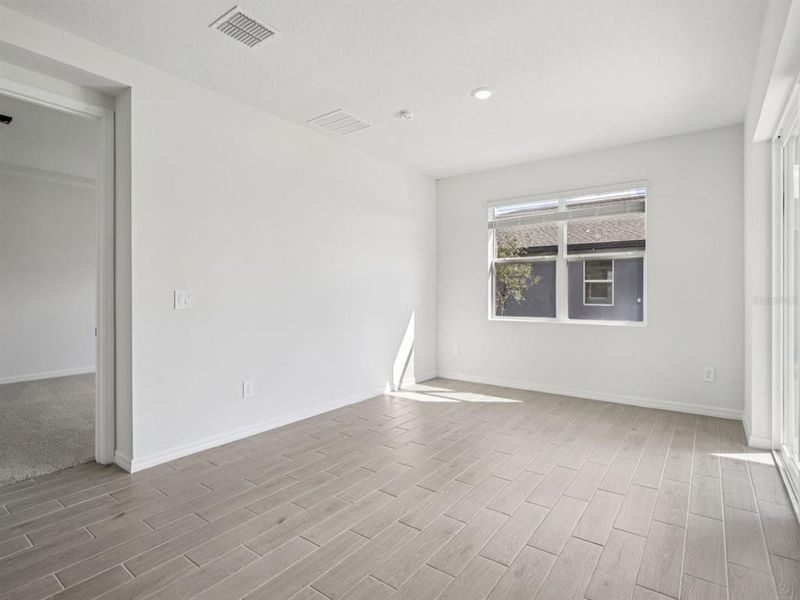 Spacious, unfurnished interior of a new home in Coasterra - Reserve Series, Palmetto (Image 21).