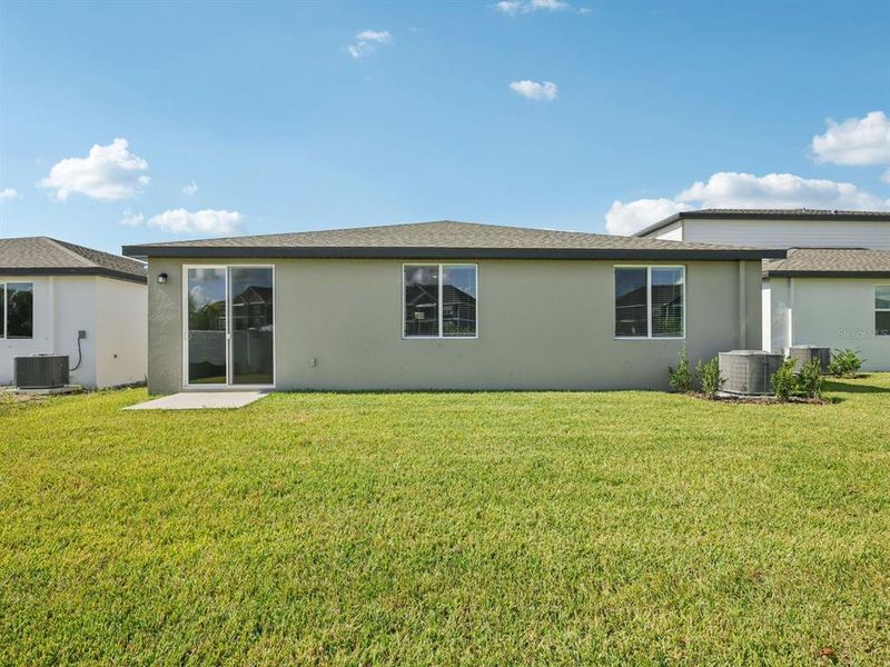 Exterior details and patio area of a home in The Grove at Stuart Crossing - Classic Series, Bartow (Image 19). Exterior details and patio area of a home in The Grove at Stuart Crossing - Classic Series, Bartow (Image 19).