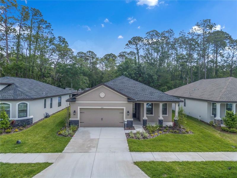 Front exterior of a new home in Rose Haven, New Port Richey, FL, highlighting curb appeal (Image 1).