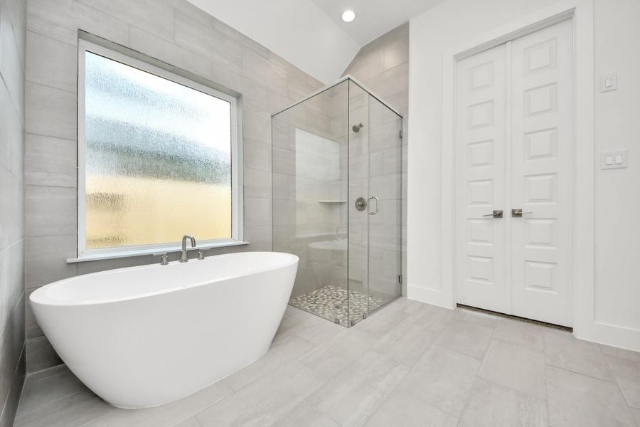 Elevate your daily routine at the elegant vanity, now equipped with double sinks, light countertops, modern hardware, and beautiful recessed lights. Elevate your daily routine at the elegant vanity, now equipped with double sinks, light countertops, modern hardware, and beautiful recessed lights.