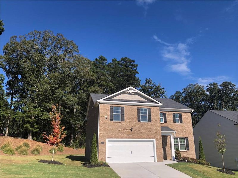 Front exterior of a new home in Brooks Village, Dacula, GA, highlighting curb appeal (Image 23).