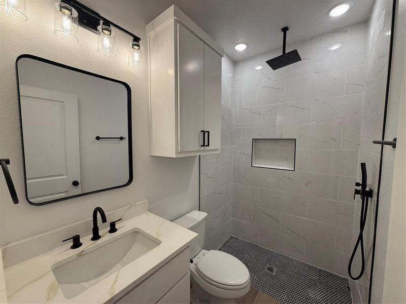 Full bathroom with vanity and a stall shower Full bathroom with vanity and a stall shower