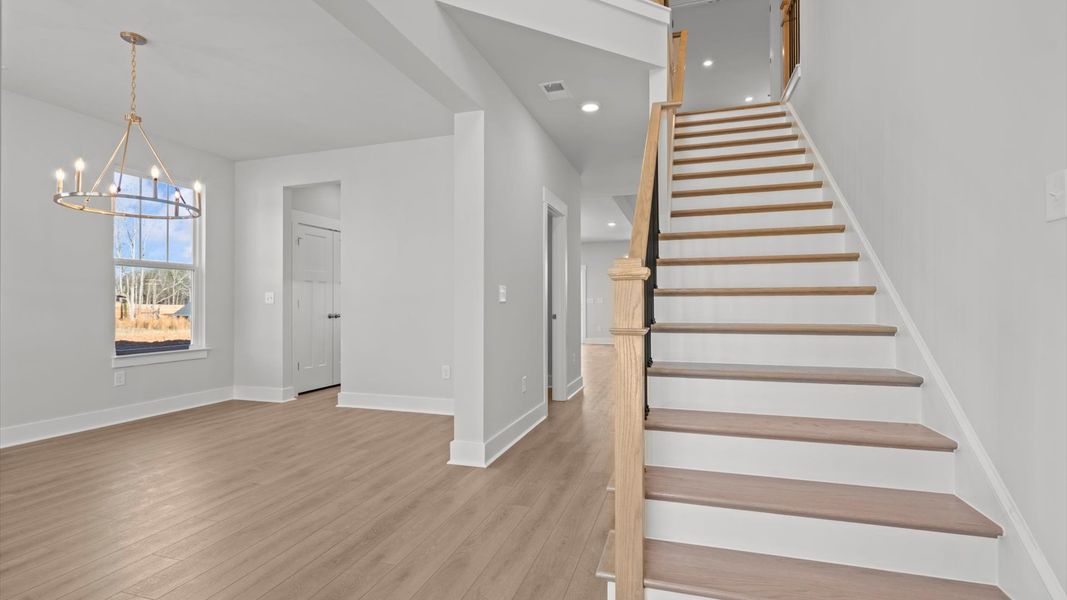 First-class entryway featuring hardwood floors and accomplished architectural style
