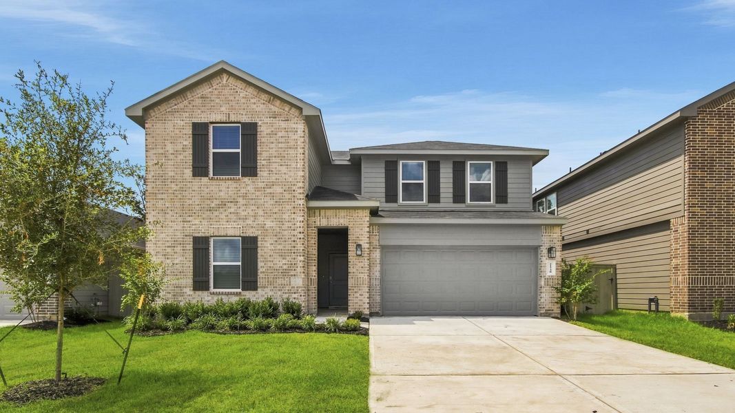 Front exterior of a new home in Harrington Trails at The Canopies, Splendora, TX, highlighting curb appeal (Image 1). Front exterior of a new home in Harrington Trails at The Canopies, Splendora, TX, highlighting curb appeal (Image 1).
