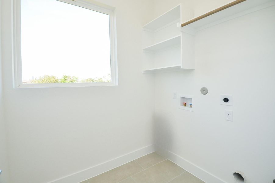 Laundry (Sample photo from similar floor plan built by the builder)