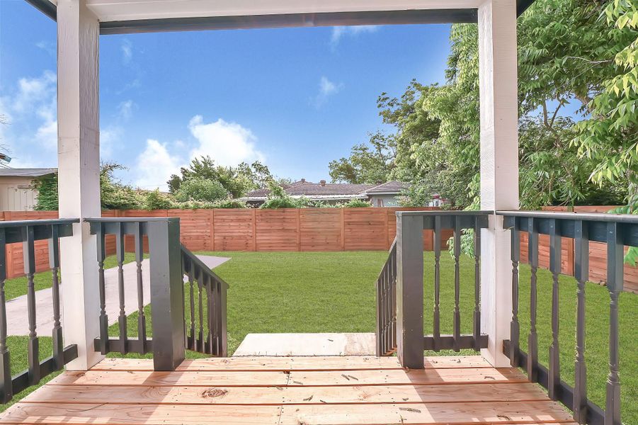 Enjoy serene backyard views from this charming porch, perfect for relaxation and entertaining. Enjoy serene backyard views from this charming porch, perfect for relaxation and entertaining.