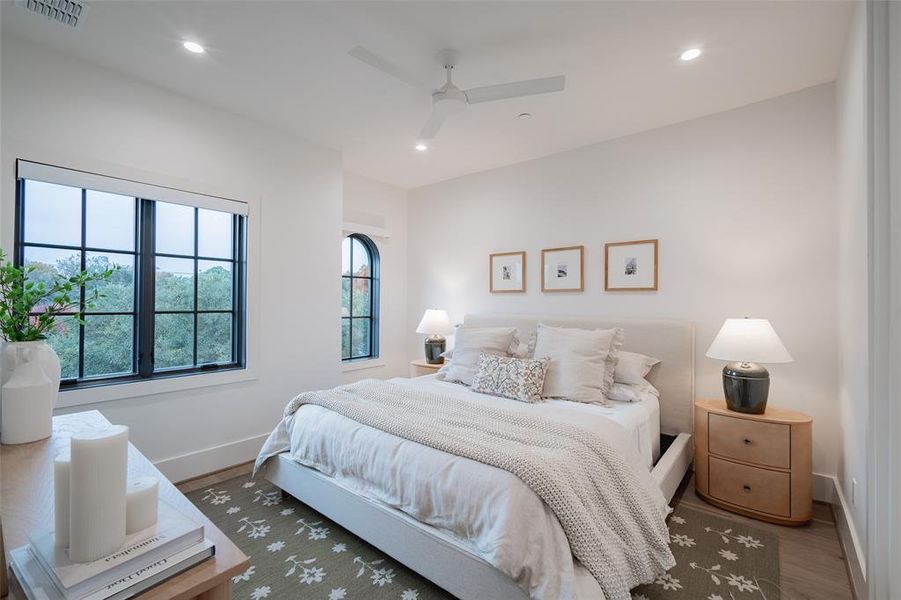 Bedroom with wood-type flooring and ceiling fan