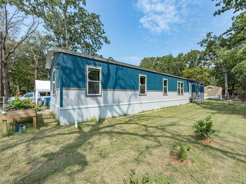 Front exterior of a new home in , Gun Barrel City, TX, highlighting curb appeal (Image 25). Front exterior of a new home in , Gun Barrel City, TX, highlighting curb appeal (Image 25).