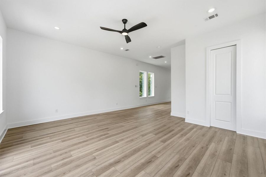 A different view of the wide open living room with soaring ceilings, recessed lighting, modern ceiling fan and rich LVP flooring gives you all the room you need to gather, entertain and truly make it your own. A different view of the wide open living room with soaring ceilings, recessed lighting, modern ceiling fan and rich LVP flooring gives you all the room you need to gather, entertain and truly make it your own.