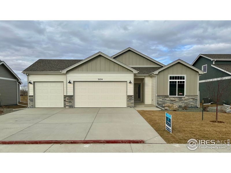 Front exterior of a new home in , Wellington, CO, highlighting curb appeal (Image 1).