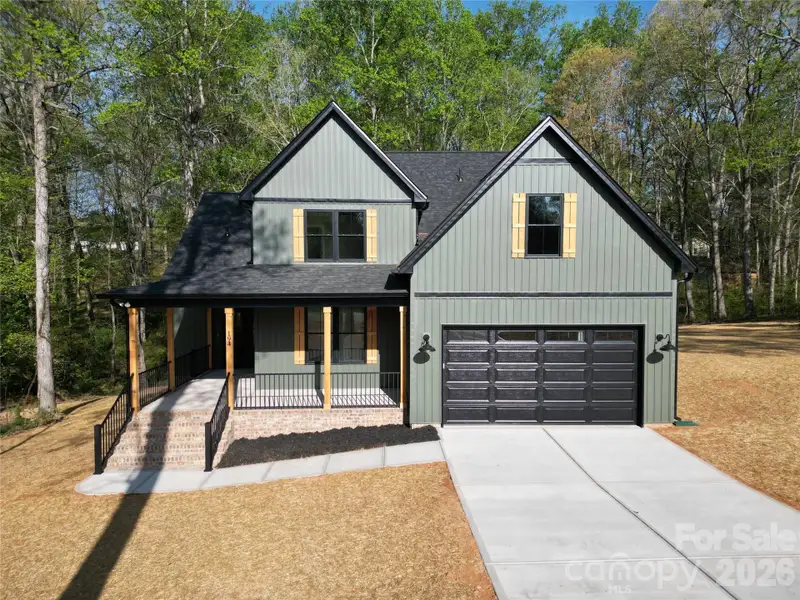 Front exterior of a new home in , Statesville, NC, highlighting curb appeal (Image 25).