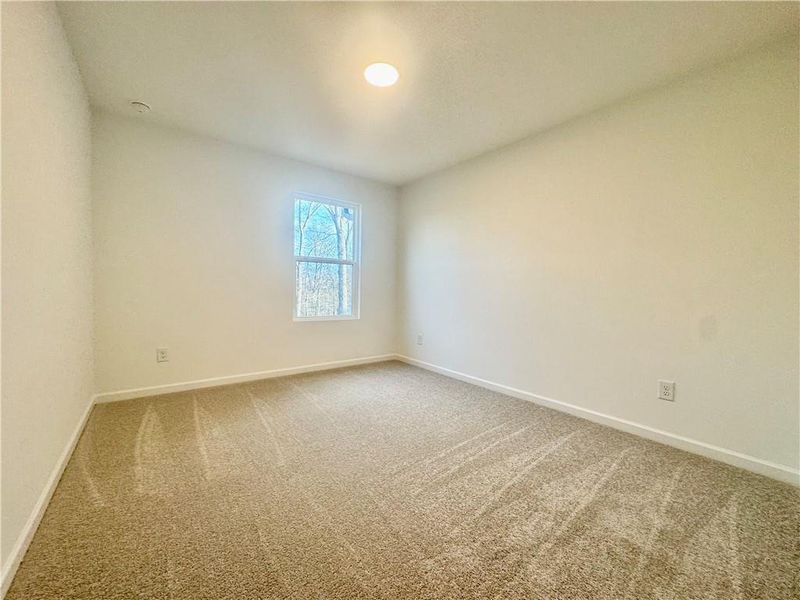 Spacious, unfurnished interior of a new home in Eastlyn Crossing, Flowery Branch (Image 19).