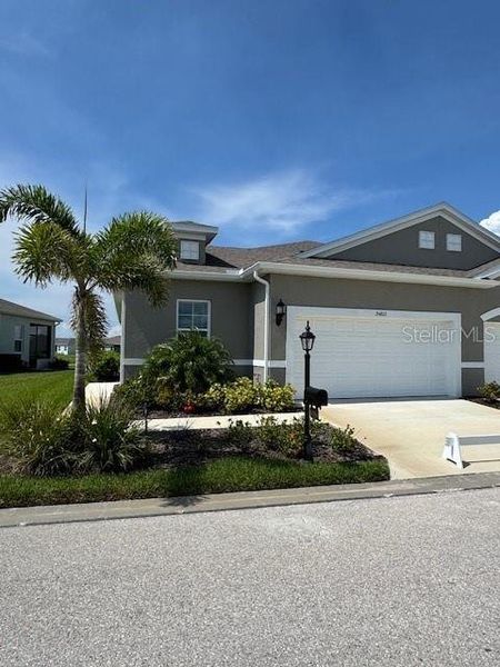 Front exterior of a new home in , Port Charlotte, FL, highlighting curb appeal (Image 1). Front exterior of a new home in , Port Charlotte, FL, highlighting curb appeal (Image 1).