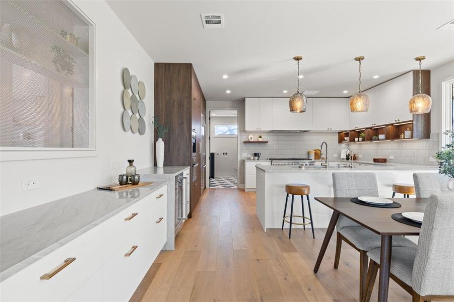 Revel in the abundance of cabinetry and expansive counter space, defining this kitchen as a functional masterpiece for both storage and gourmet creations.