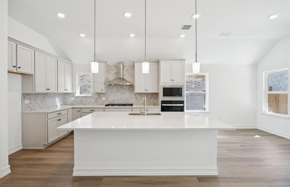 Spacious kitchen with eat-in bartop island Spacious kitchen with eat-in bartop island