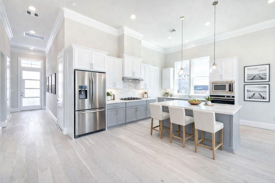 Bright first-floor living and dining bathed in natural light.   Virtual staging added.