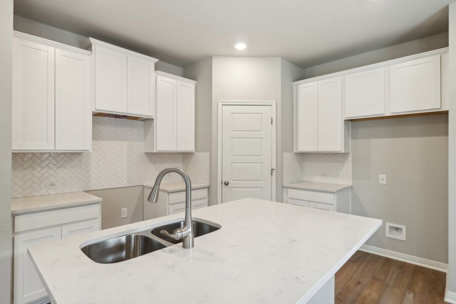 Kitchen in the Cascade floorplan at a Meritage Homes community.