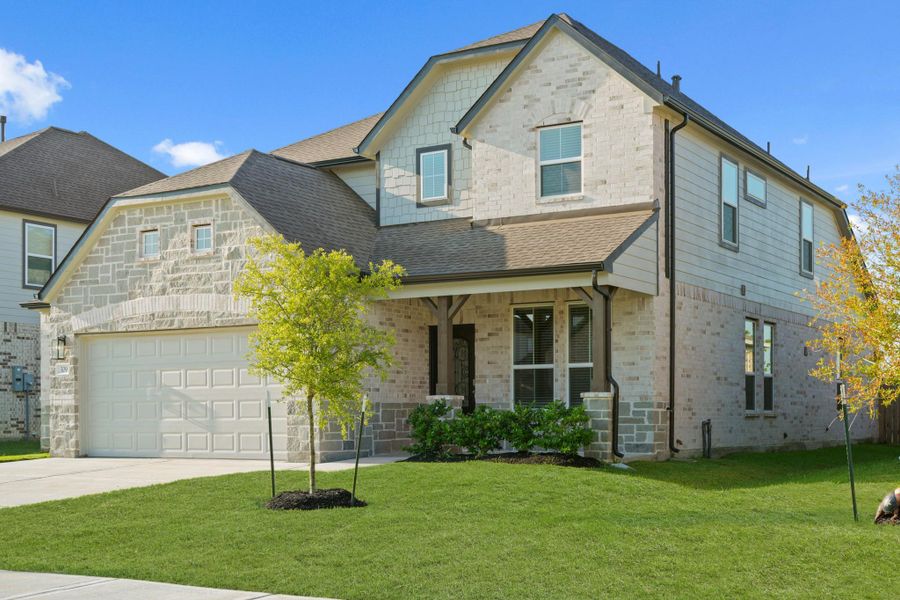 Front exterior of a new home in Beacon Hill, Waller, TX, highlighting curb appeal (Image 20).