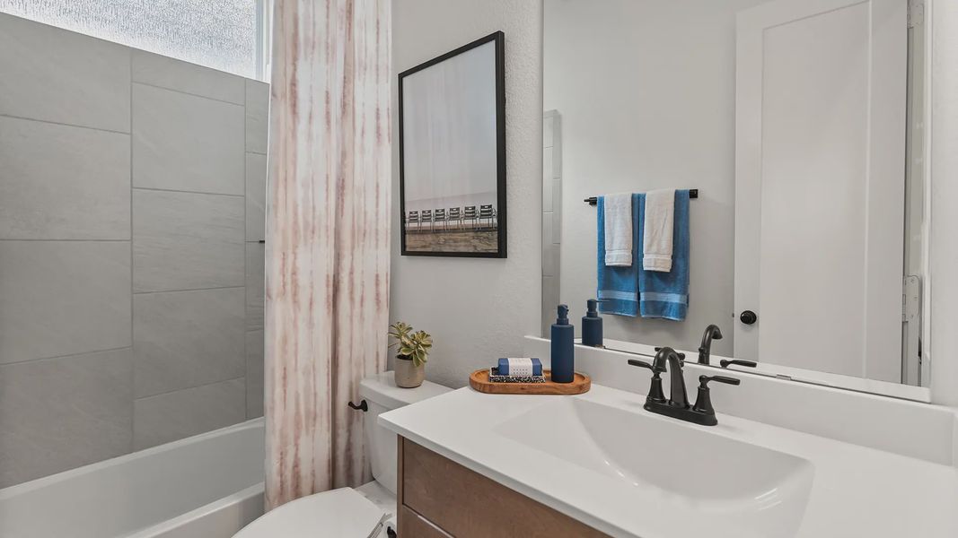 Representative furnished interior of a home built from the Hillcrest by Chesmar Homes in Artavia, Conroe (Image 14).