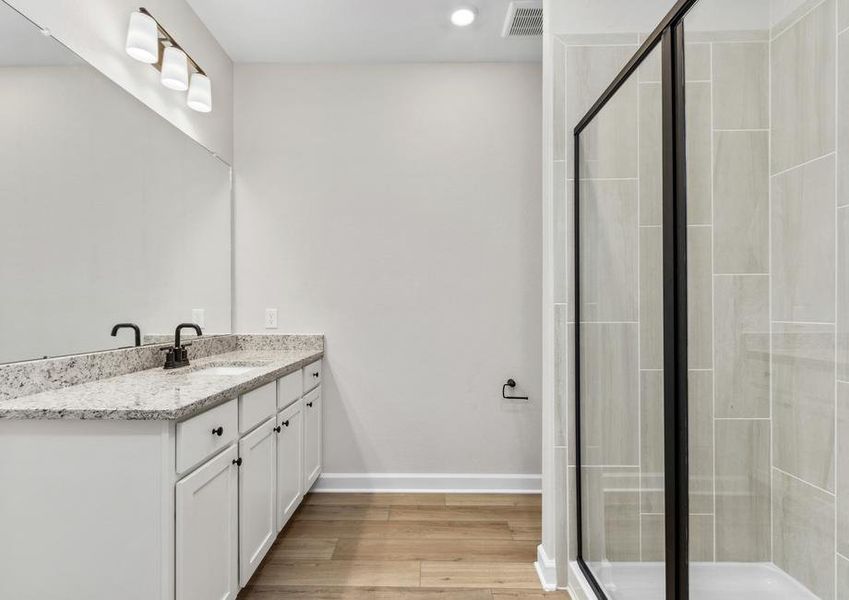 The master bath has a private commode and tons of drawer space.