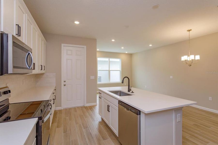 Furnished interior view inside a new home in Serenade at Ovation, Winter Garden (Image 7).