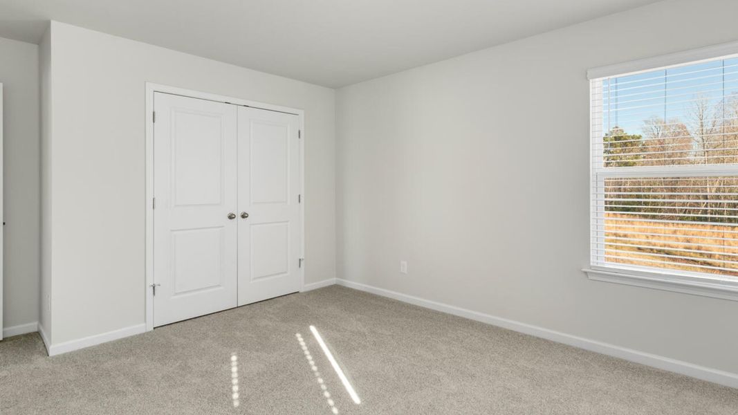 Representative unfurnished interior of a home built from the TILLMAN by D.R. Horton in Surfside Landing, Hubert (Image 46).