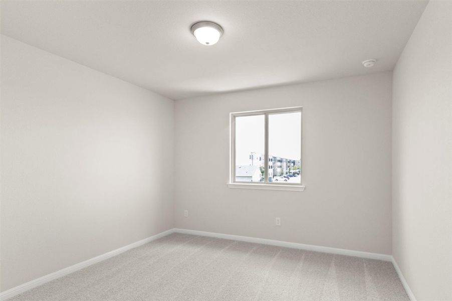 Unfurnished room with light colored carpet