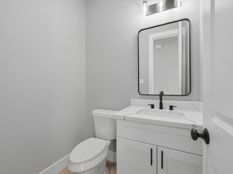 Conveniently located on the first floor, the powder bath offers modern finishes for both residents and guests. Conveniently located on the first floor, the powder bath offers modern finishes for both residents and guests.