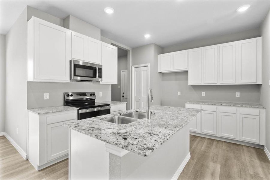 All new appliances.  Just bring the refrigerator, washer and dryer and your all set!  Notice the garage door through the entry on the left. Pantry is behind the folding door. Take another look at the ample storage with all of the cabinets.