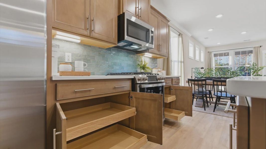 Highly skilled craftsmanship shines in this modern kitchen with superior cabinetry and quartz countertops in Greenville, SC