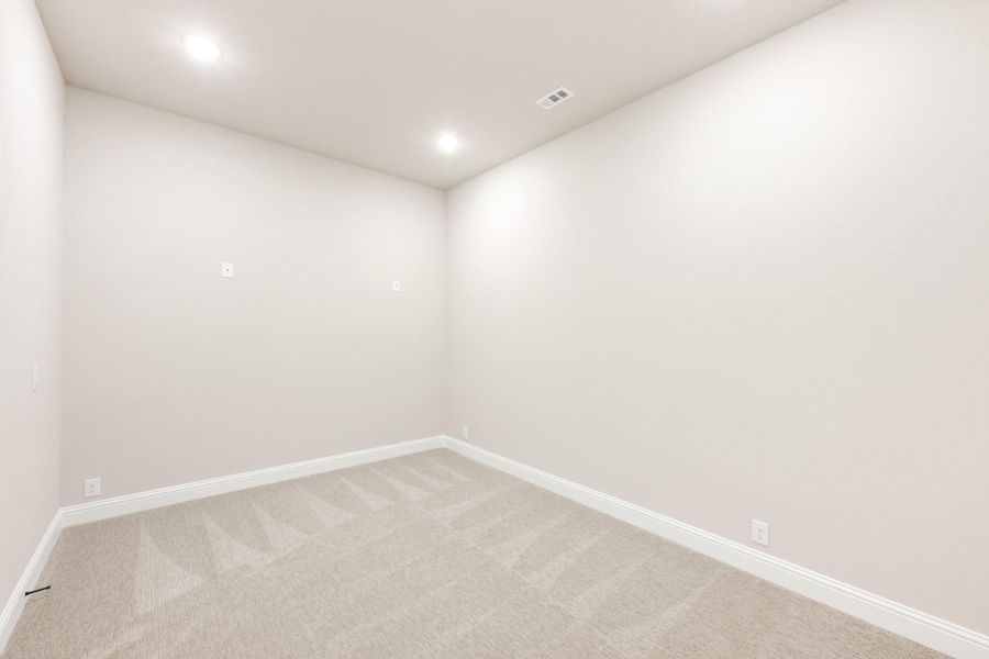 Empty room with white walls, recessed lighting, and beige carpet flooring Empty room with white walls, recessed lighting, and beige carpet flooring