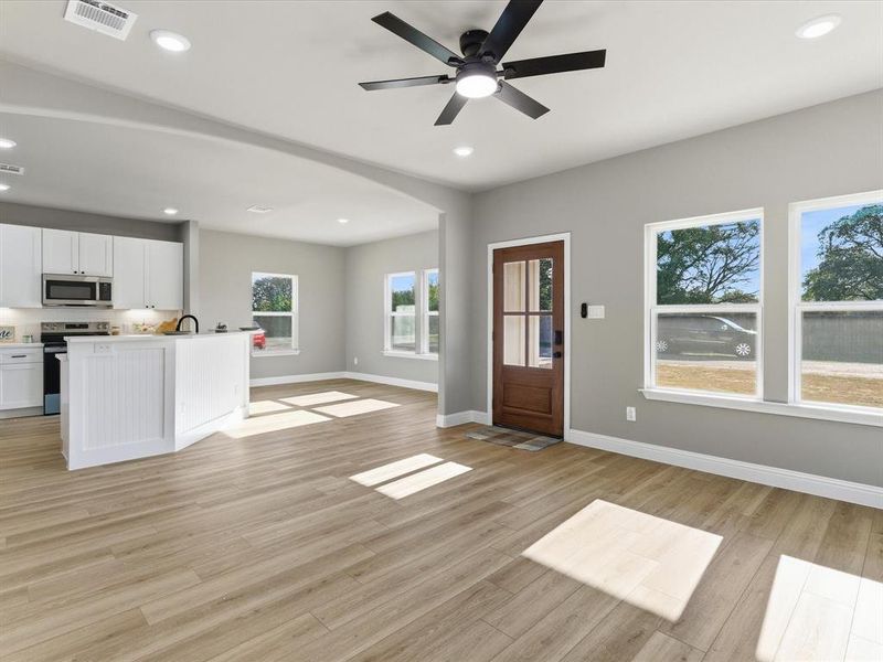 Entrance foyer featuring recessed lighting, light wood finished floors, and a ceiling fan Entrance foyer featuring recessed lighting, light wood finished floors, and a ceiling fan