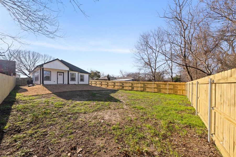 View of fenced backyard