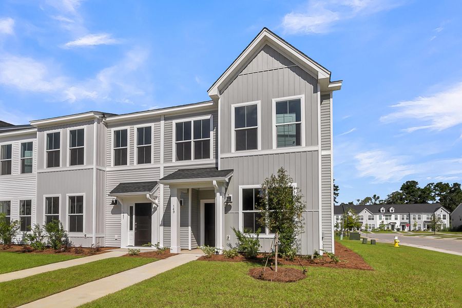 Front exterior of a new home in Six Oaks, Summerville, SC, highlighting curb appeal (Image 1).