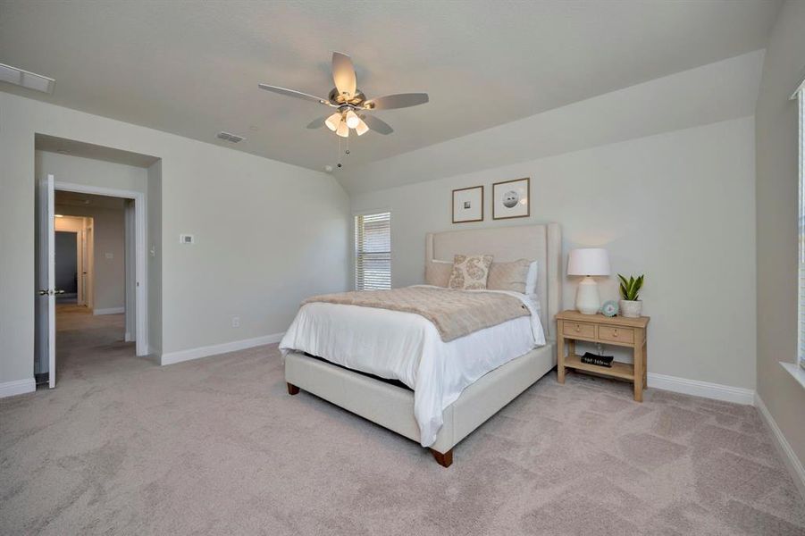 Spacious primary bedroom with en-suite bath.