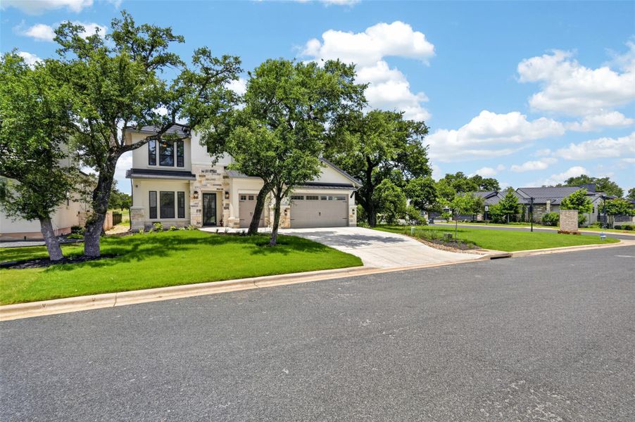 Well-maintained curb appeal with mature trees and a neatly paved driveway define this welcoming residence. Well-maintained curb appeal with mature trees and a neatly paved driveway define this welcoming residence.