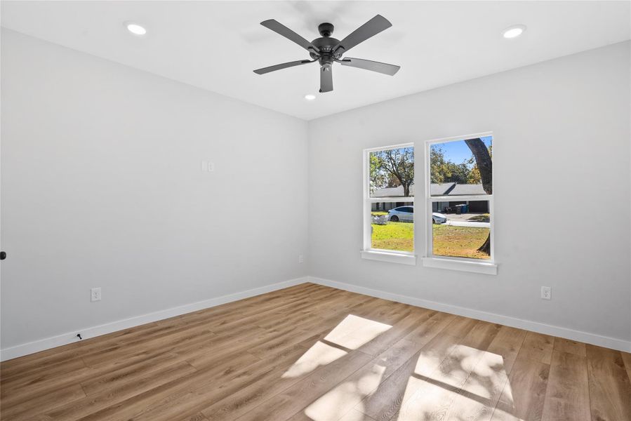 Unfurnished room with light wood-style flooring, recessed lighting, and ceiling fan