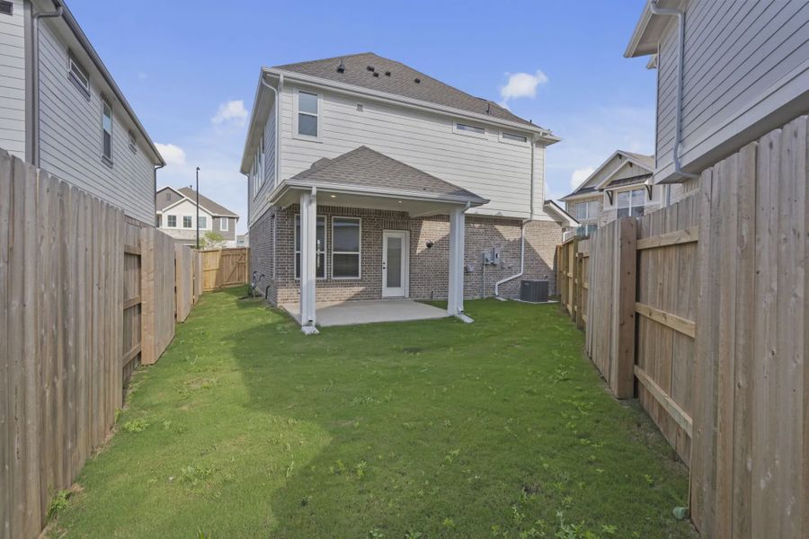 Exterior details and patio area of a home in Elyson Courtyard Collection, Katy (Image 3).