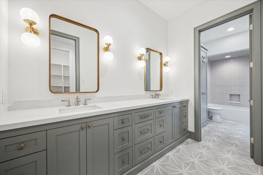 Grand upstairs secondary suite with double sinks, designer tiles/paint and high end finishes! Great custom storage! Separate Tub area. Grand upstairs secondary suite with double sinks, designer tiles/paint and high end finishes! Great custom storage! Separate Tub area.