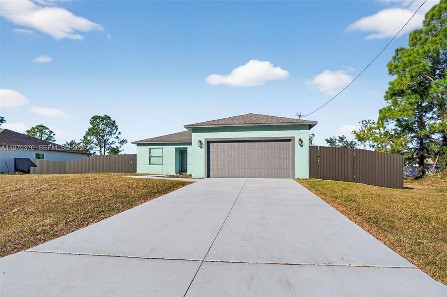 Front exterior of a new home in , Lehigh Acres, FL, highlighting curb appeal (Image 2). Front exterior of a new home in , Lehigh Acres, FL, highlighting curb appeal (Image 2).