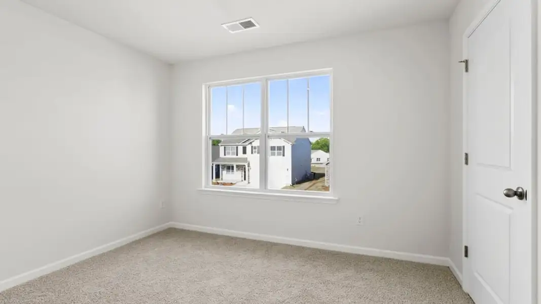 Spacious, unfurnished interior of a new home in Durbin Meadows Traditions, Fountain Inn (Image 24).