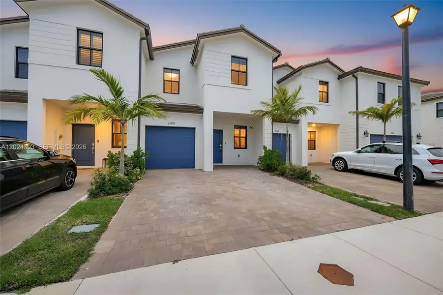 Front exterior of a new home in , Miami, FL, highlighting curb appeal (Image 1). Front exterior of a new home in , Miami, FL, highlighting curb appeal (Image 1).