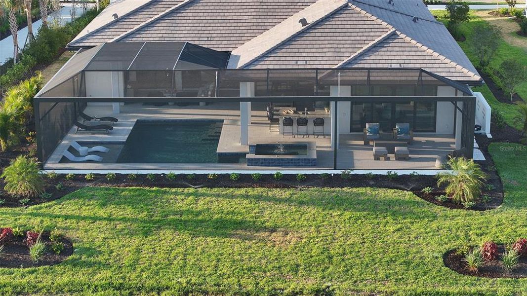 Exterior details and patio area of a home in Wild Blue at Waterside, Sarasota (Image 48).
