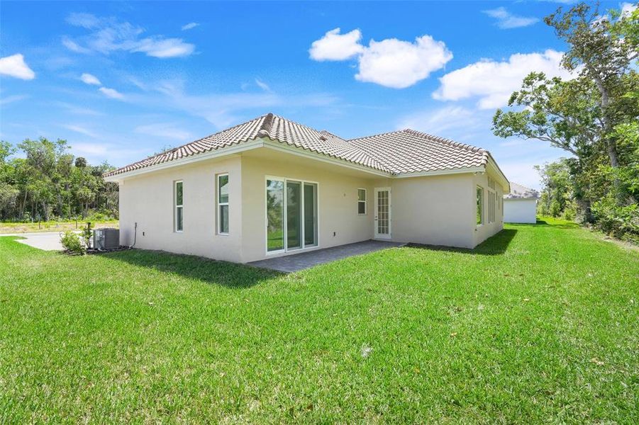 Exterior details and patio area of a home in Toscana, Palm Coast (Image 24).
