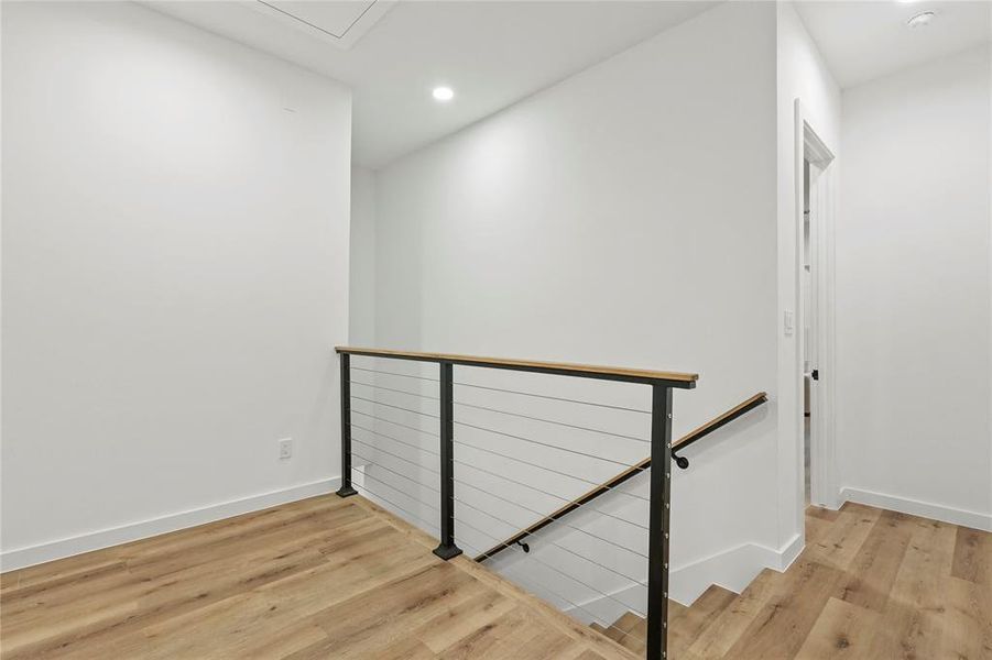 Hallway featuring light hardwood / wood-style flooring