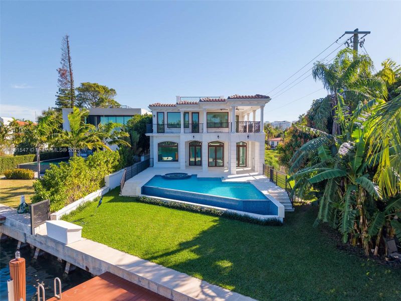 Front exterior of a new home in , Surfside, FL, highlighting curb appeal (Image 21).