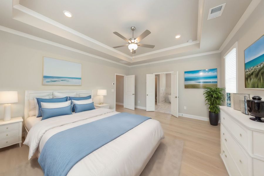 The master suite includes two walkin closets and private bath with luxurious shower