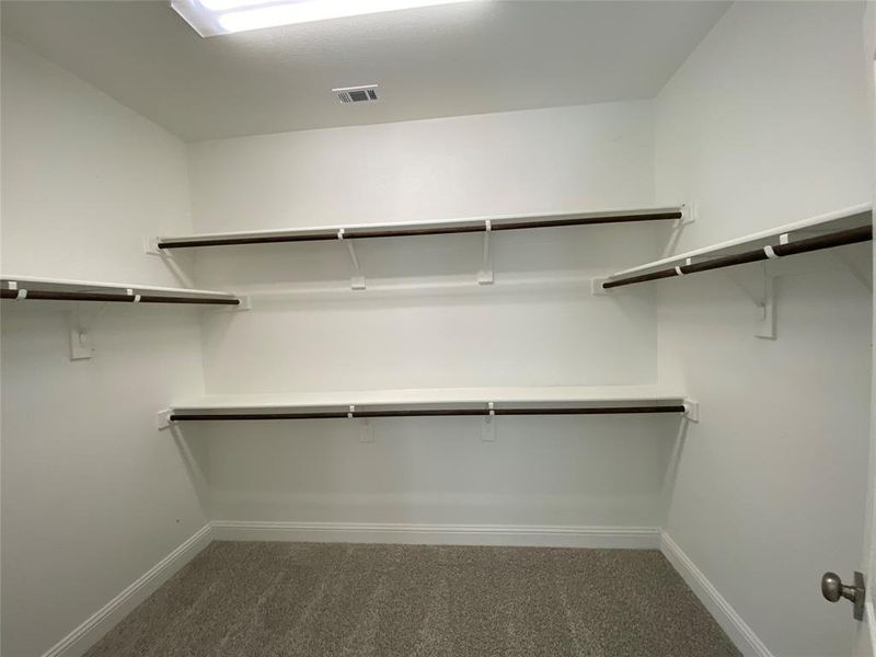 Master large walk-in closet with lots of storage Master large walk-in closet with lots of storage